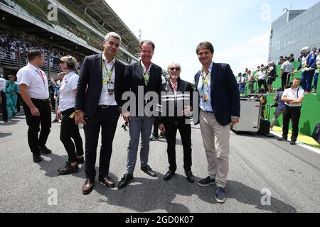 Bernie Ecclestone (GBR) on the grid with Arnaud Boetsch (FRA) Rolex Communication and Image Director on the grid. Stock Photo