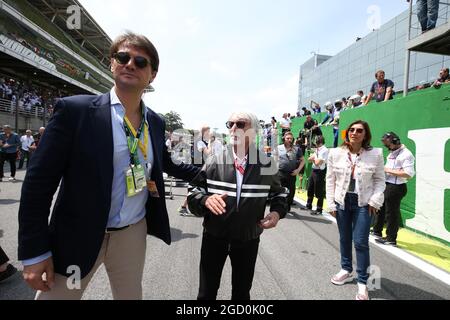 Bernie Ecclestone (GBR) on the grid with Arnaud Boetsch (FRA) Rolex Communication and Image Director on the grid. Stock Photo