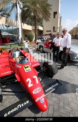 Alain Prost (FRA) Renault F1 Team Special Advisor and Jerome Stoll (FRA) Renault Sport F1 President with the 1982 Ferrari 126C2 driven by Patrick Tambay on display in the paddock - Sotherby's. Abu Dhabi Grand Prix, Saturday 30th November 2019. Yas Marina Circuit, Abu Dhabi, UAE. Stock Photo