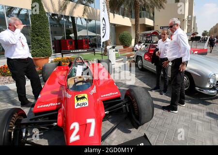 Alain Prost (FRA) Renault F1 Team Special Advisor and Jerome Stoll (FRA) Renault Sport F1 President with the 1982 Ferrari 126C2 driven by Patrick Tambay on display in the paddock - Sotherby's. Abu Dhabi Grand Prix, Saturday 30th November 2019. Yas Marina Circuit, Abu Dhabi, UAE. Stock Photo