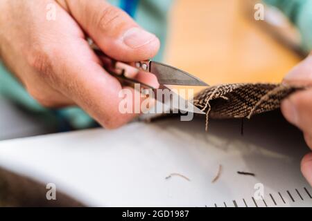 Multiethnic team of fashion designers working working in a clothing start-up workshop - Multiracial group of stylists, tailor designers and dressmaker Stock Photo