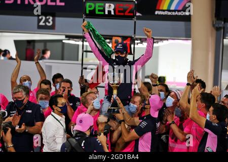 Race winner Sergio Perez (MEX) Racing Point F1 Team celebrates with the team. Sakhir Grand Prix, Sunday 6th December 2020. Sakhir, Bahrain. Stock Photo