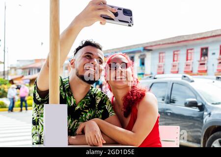 Happy couple taking selfie on smartphone Stock Photo