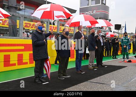 (L to R): Dr. Angelo Sticchi Damiani (ITA) Aci Csai President; Jean Todt (FRA) FIA President; Stefano Domenicali (ITA) Formula One President and CEO; Greg Maffei (USA) Liberty Media Corporation President and Chief Executive Officer; and Chase Carey (USA), as the grid observes the national anthem. Emilia Romagna Grand Prix, Sunday 18th April 2021. Imola, Italy. FIA Pool Image for Editorial Use Only Stock Photo