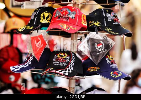 Souvenir Monaco Grand Prix caps on rack 