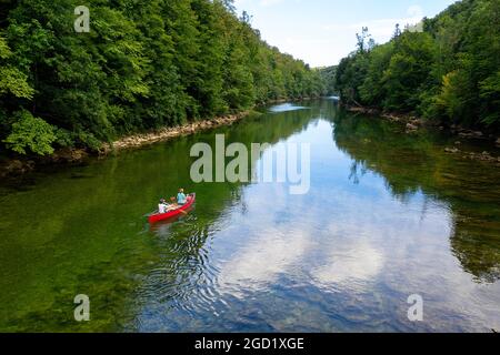 Aerial view of mother and son riding a canoe on the Kolpa River, on the border of Slovenia and Croatia, taken by drone Stock Photo