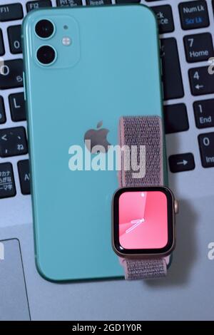 Mint Green color iPhone 11 with apple watch. iPhone  apple watch quickly is fastest selling smartphone  watch brand Stock Photo