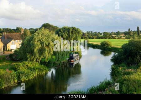 Beautiful still river meandering through the Cambridgshire countryside Stock Photo