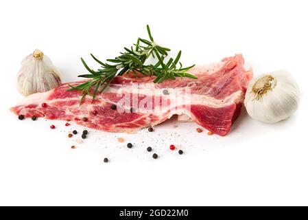 Fresh juicy pork chop with herbs and rosemary isolated on white, close up. Stock Photo