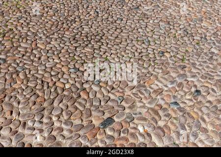 Pebble pavement in Bologna, Italy on a summer day Stock Photo