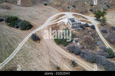 Aerial view drone photograph of an abandoned and deserted village with ruins of houses. Stock Photo