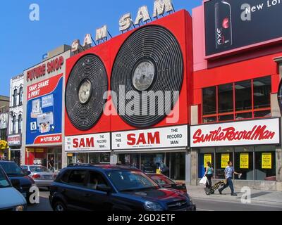 Toronto, Canada - July 15, 2005: The flagship Sam the Record Man store at 347 Yonge with its iconic neon sign was a Toronto landmark from 1961 to 2007. The franchise was founded in 1937 by Sam Sniderman and was at one time Canada’s largest music retailer. Sam is still recognized for his contributions to the Canadian music industry. Stock Photo