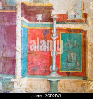 Painted wall with green monochromes Imaginary columns, depicted as plant trunks, stand out of a podium, next to a shrine. They are set against a green partition wall depicting a landscape with architectures. A flower-like candelabrum is right above fresco Portici, from a villa discovered near the Royal stable 20-10 BC Stock Photo