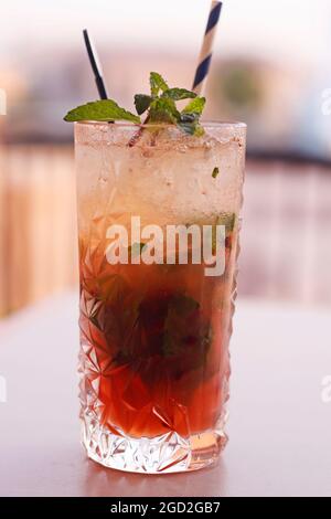 cocktail passion fruit mojito drink, vodka, mint and lemon based alcoholic drink Stock Photo
