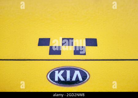 Hood of a yellow Kia Rio taxi car frozen after the first autumn frost Stock Photo