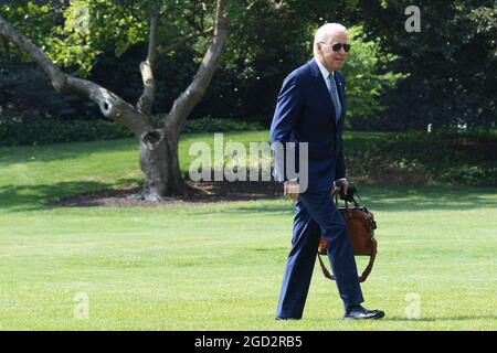 Washington, United States. 10th Aug, 2021. US President Joe Biden walks from Marine One helicopter after arriving to White House, in Washington DC. Credit: SOPA Images Limited/Alamy Live News Stock Photo