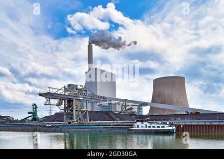 Coal steam power plant in Karlsruhe in Germany used for generation of electricity and district heating from hard coal Stock Photo