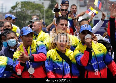 Caracas, Venezuela. 10th Aug, 2021. Keydomar Vallenilla (r) and Julio Mayora (l) show off their Olympic medals as they are cheered by fans upon arrival after the Tokyo Olympics. Credit: Jesus Vargas/dpa/Alamy Live News Stock Photo