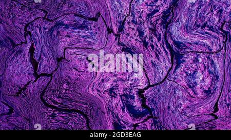 Texture with wavy decorative lines in purple, abstract background like space, earth on mars Stock Photo