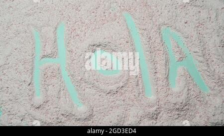Hello Spanish, speak HOLA Spanish. Powder texture. Stock Photo