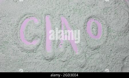 Italian greeting ciao, word hello in italian powder texture Stock Photo