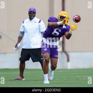 August 10, 2021: LSU defensive back Derrick Davis Jr. (6) breaks on a pass as Defensive Coordinator Daronte Jones looks on during the first week of fall football camp at the LSU Charles McClendon Practice Facility in Baton Rouge, LA. Jonathan Mailhes/CSM Stock Photo