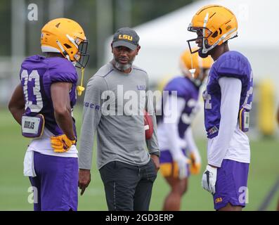August 10, 2021: LSU Defensive Back Coach Corey Raymond talks with Lloyd Cole (33) and Darren Evans (24) during the first week of fall football camp at the LSU Charles McClendon Practice Facility in Baton Rouge, LA. Jonathan Mailhes/CSM Stock Photo