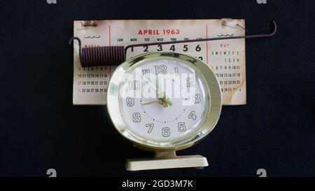 An Old Alarm Clock and an April 1963 Calendar Stock Photo - Alamy