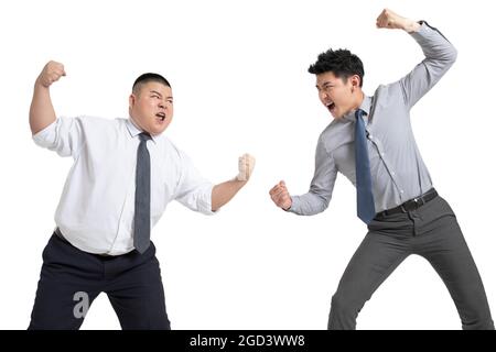 Young businessmen fighting Stock Photo