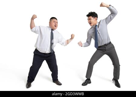 Young businessmen fighting Stock Photo