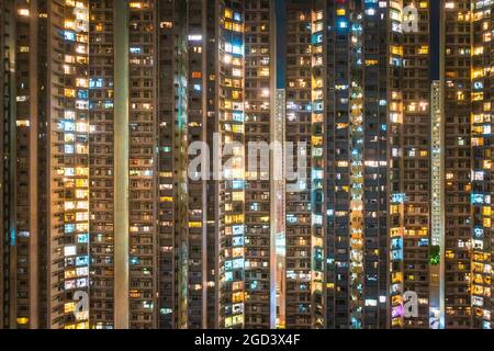 Exterior of skyscraper apartment in South of Hong Kong, at night Stock Photo