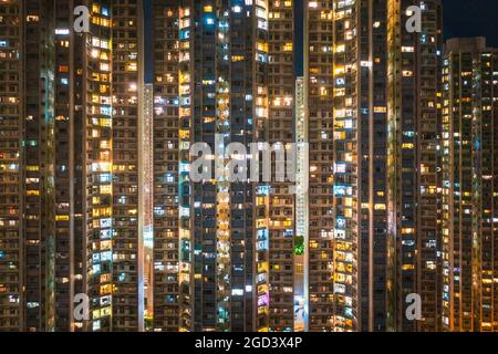 Exterior of skyscraper apartment in South of Hong Kong, at night Stock Photo