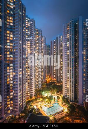 Exterior of skyscraper apartment in South of Hong Kong, at night Stock Photo