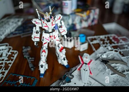Bangkok, Thailand - August 10, 2021 : The Unicorn Gundam plastic model kit was assembled on the table. Stock Photo
