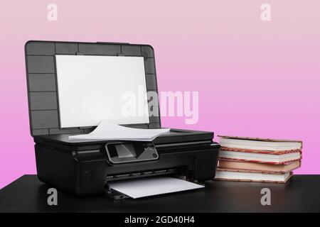 Compact home laser printer against pink background Stock Photo