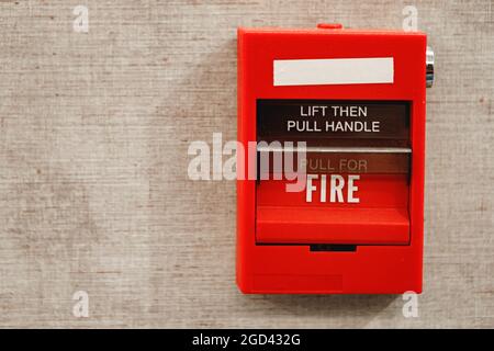 Fire alarm box on the wall close up Stock Photo