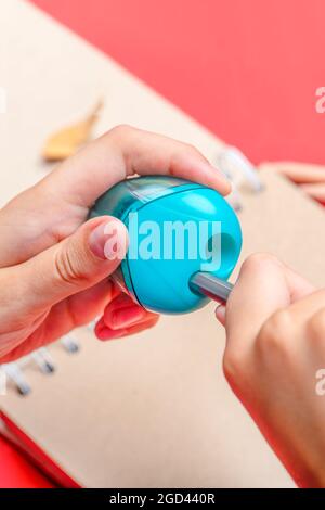 Kid Hands Holds Color Pencil And Think About Drawing Things On White Blank  Paper On Desk Or Study Table Stock Photo, Picture and Royalty Free Image.  Image 99341644.