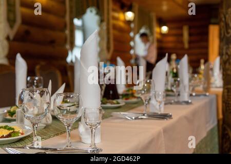 Food served on table in a wooden manor house during a birthday party or wedding in Eastern Europe Stock Photo