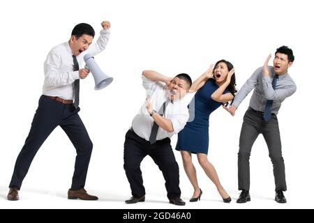 Mature businessman shouting at coworkers Stock Photo
