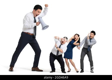 Mature businessman shouting at coworkers Stock Photo