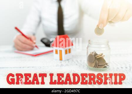 Hand writing sign Great Leadership. Word for motivating showing to act towards achieving a common goal New home installments and investments plans Stock Photo