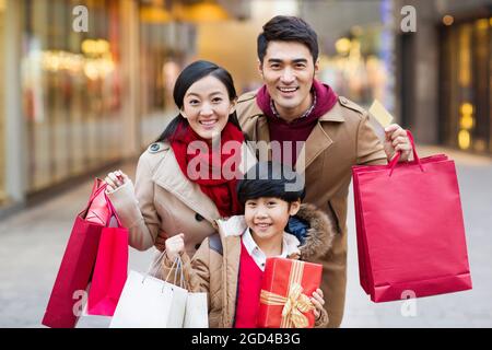 Happy family shopping for Chinese New Year Stock Photo