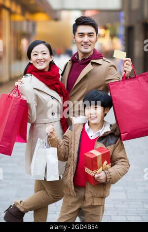 Happy family shopping for Chinese New Year Stock Photo