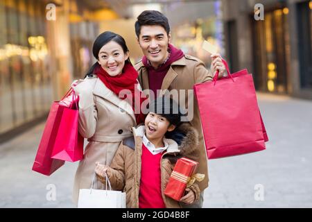 Happy family shopping for Chinese New Year Stock Photo