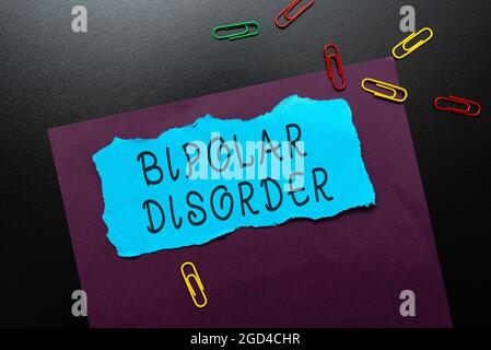 Hand writing sign Bipolar Disorder. Word for mental illness that brings severe high and low moods Thinking New Bright Ideas Renewing Creativity And Stock Photo