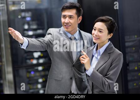 Business persons in computer room Stock Photo