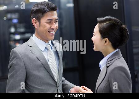 Business persons in computer room Stock Photo