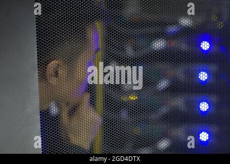 Technician doing maintenance in computer room Stock Photo