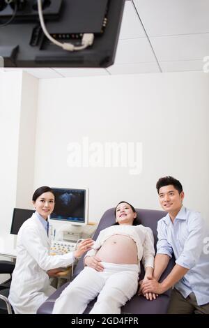 Pregnant woman having fetal sonogram Stock Photo