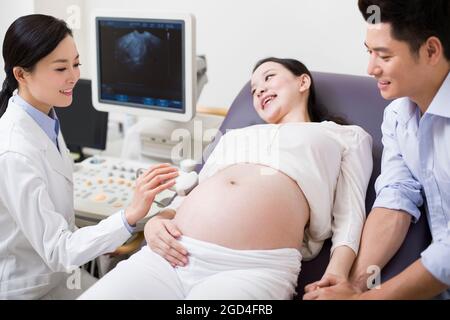 Pregnant woman having fetal sonogram Stock Photo